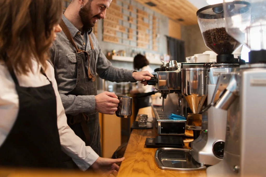 Sustainable business partners working at coffee machine
