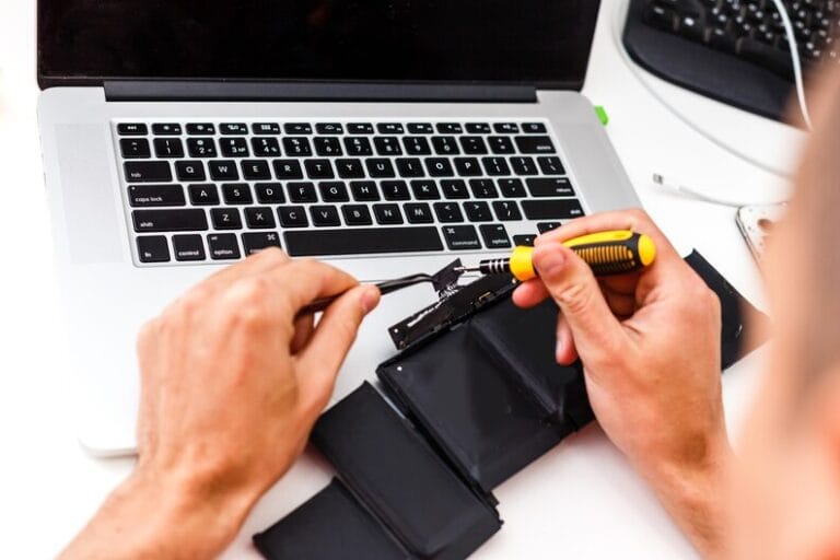 freepicdownloader.com engineer repairs laptop pc computer motherboard installs equipment cpu medium 1 768x512
